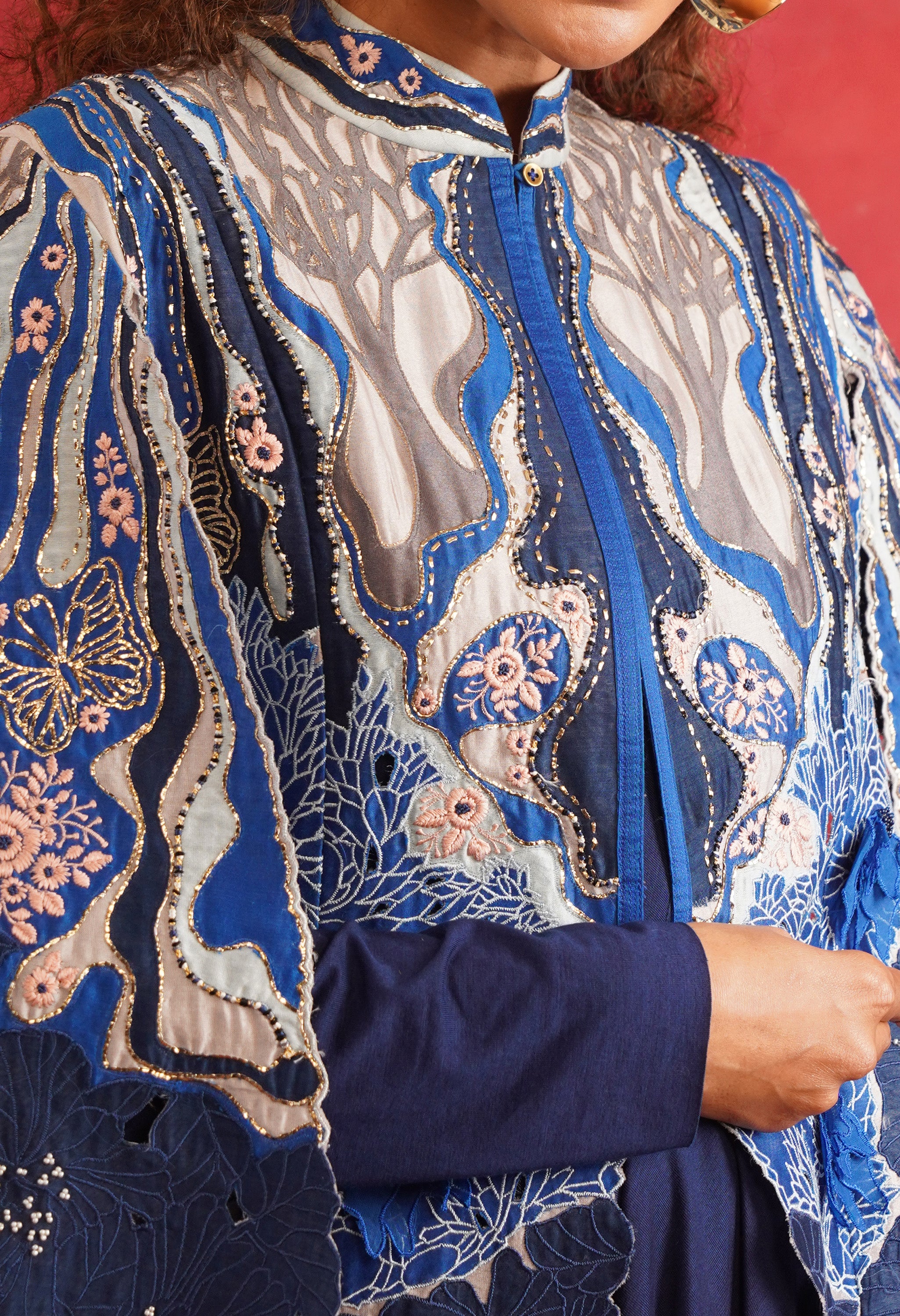 EMBROIDERED CAPE JACKET WITH DRAPED JERSY INNER