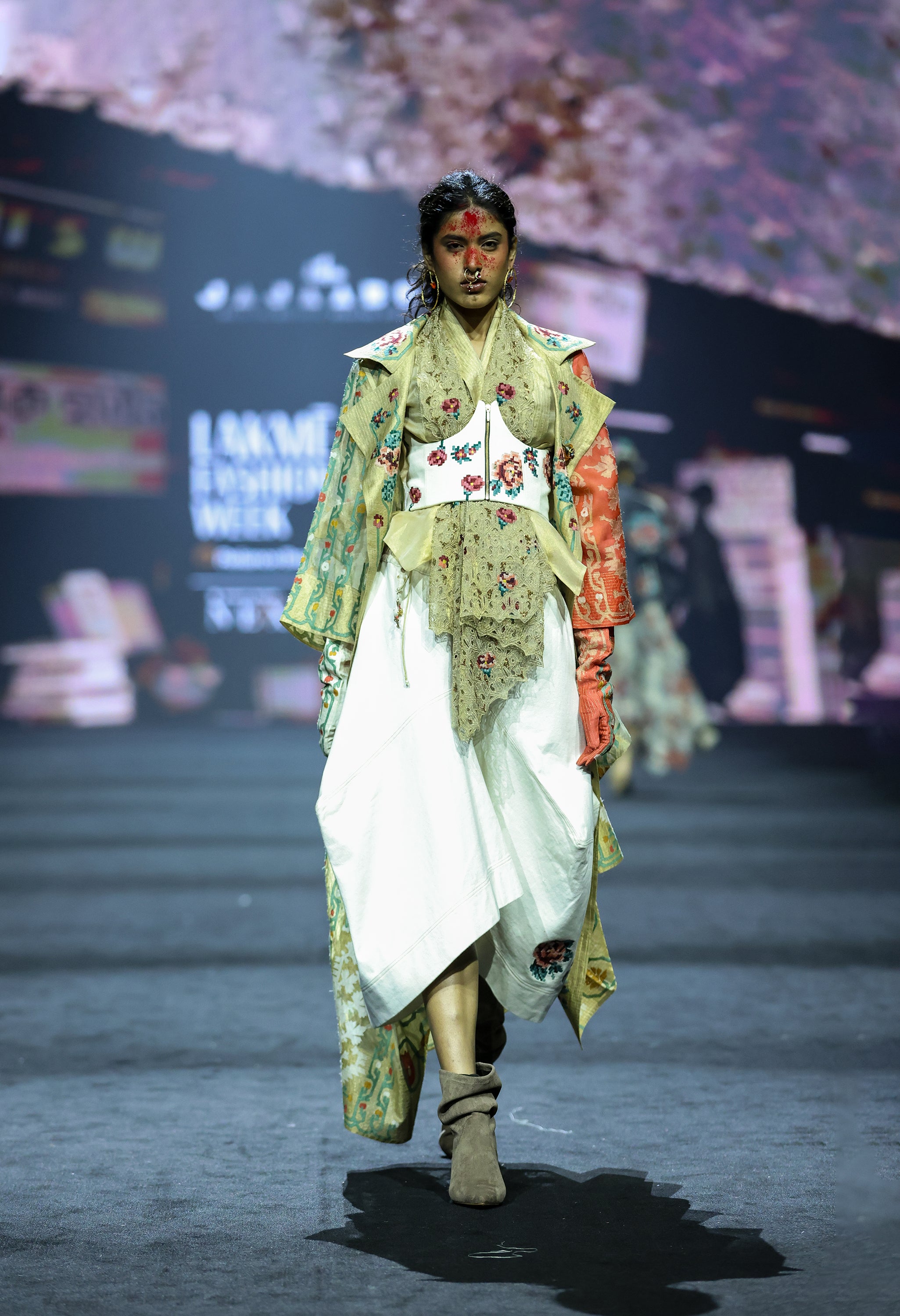 EMB LONG GOLD JACKET WITH DRAPED GOLD TOP + EMB CORSET BELT AND DENIM BARREL SKIRT