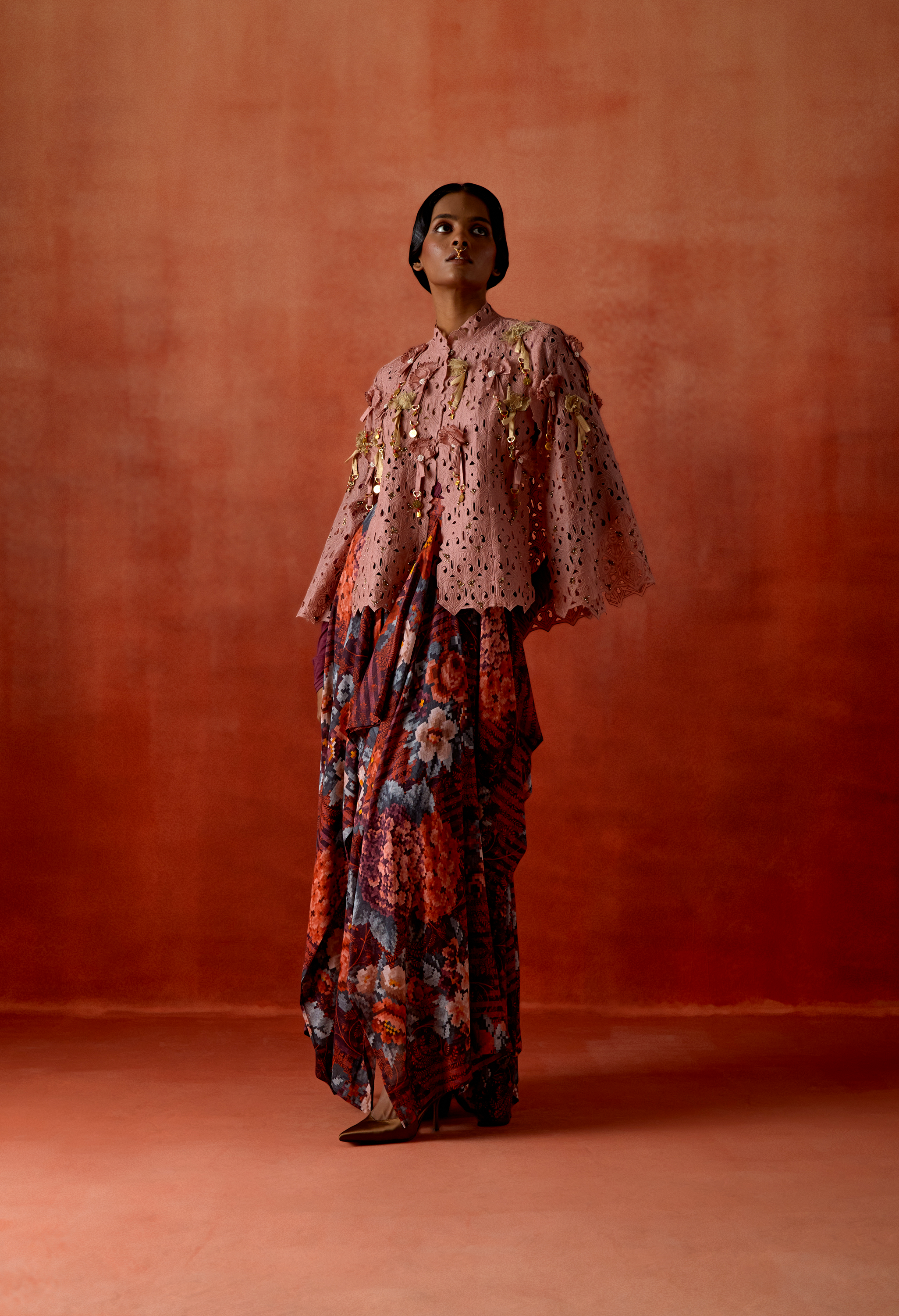 CUTWORK CAPE WITH DRAPED SKIRT