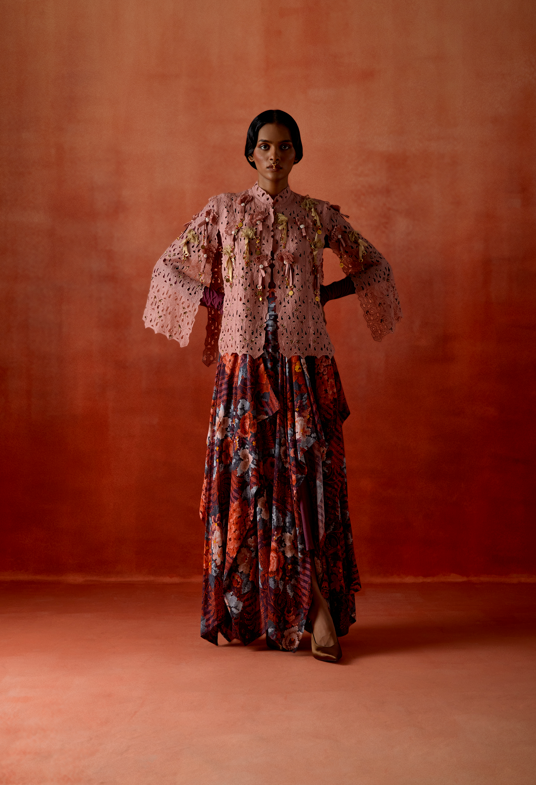 CUTWORK CAPE WITH DRAPED SKIRT