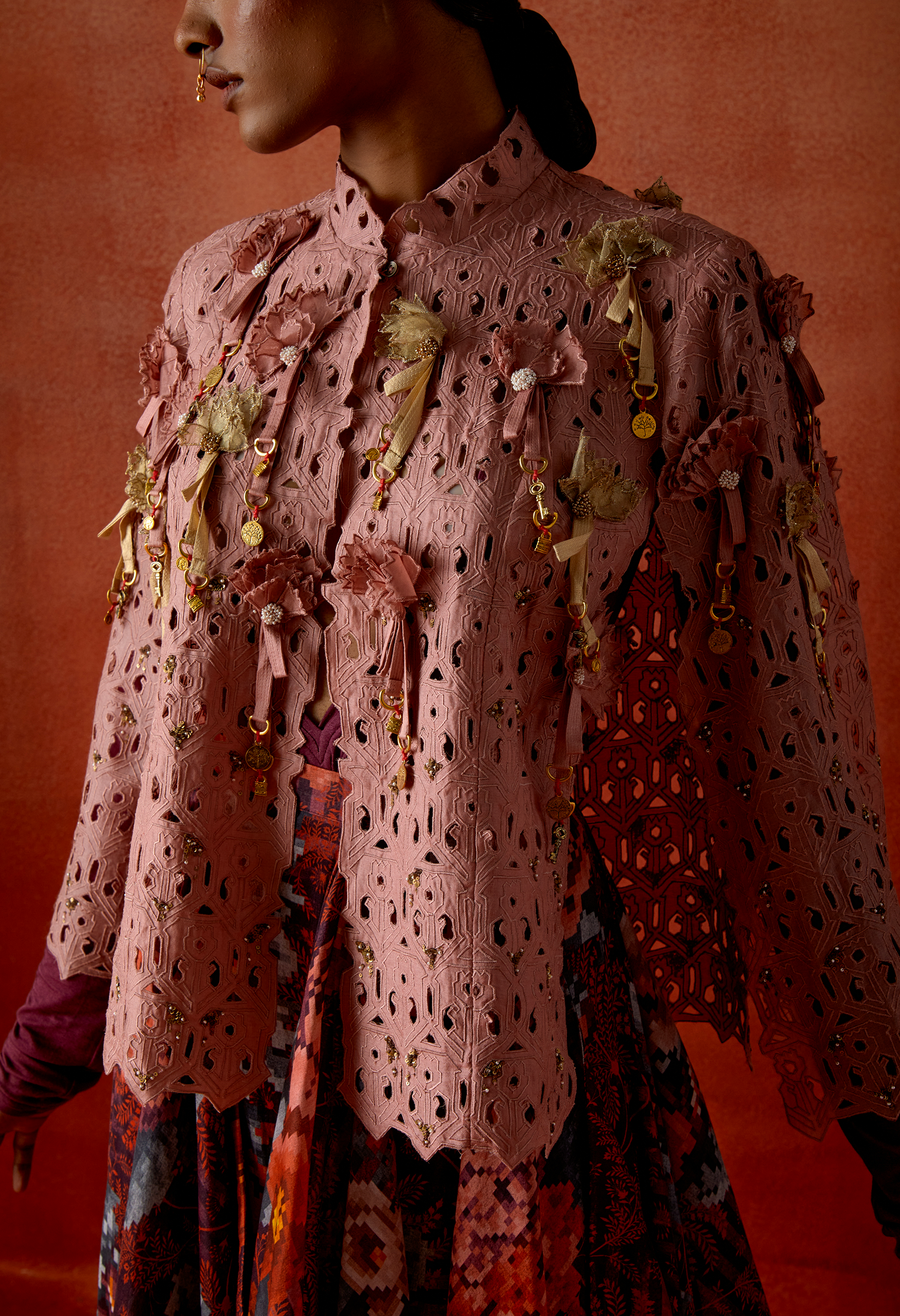 CUTWORK CAPE WITH DRAPED SKIRT